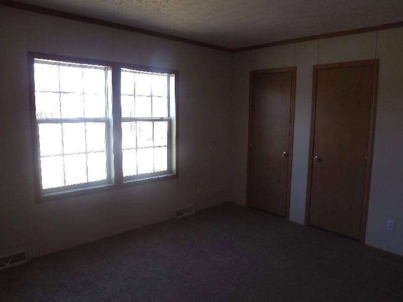 27 Dodge Road Burnham, ME 04922 - Photo 13 of 14 Master Bedroom. Home has a lot of...