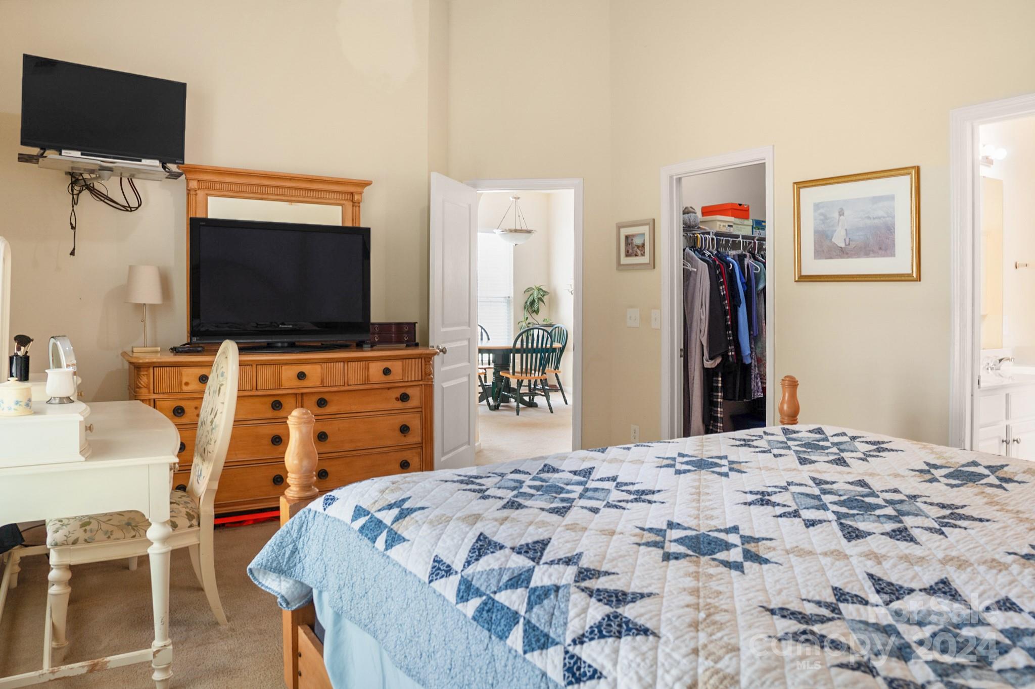 508 Marblewood Court Fort Mill, SC 29708 - Photo 11 of 21 a bedroom with a bed and a flat screen tv