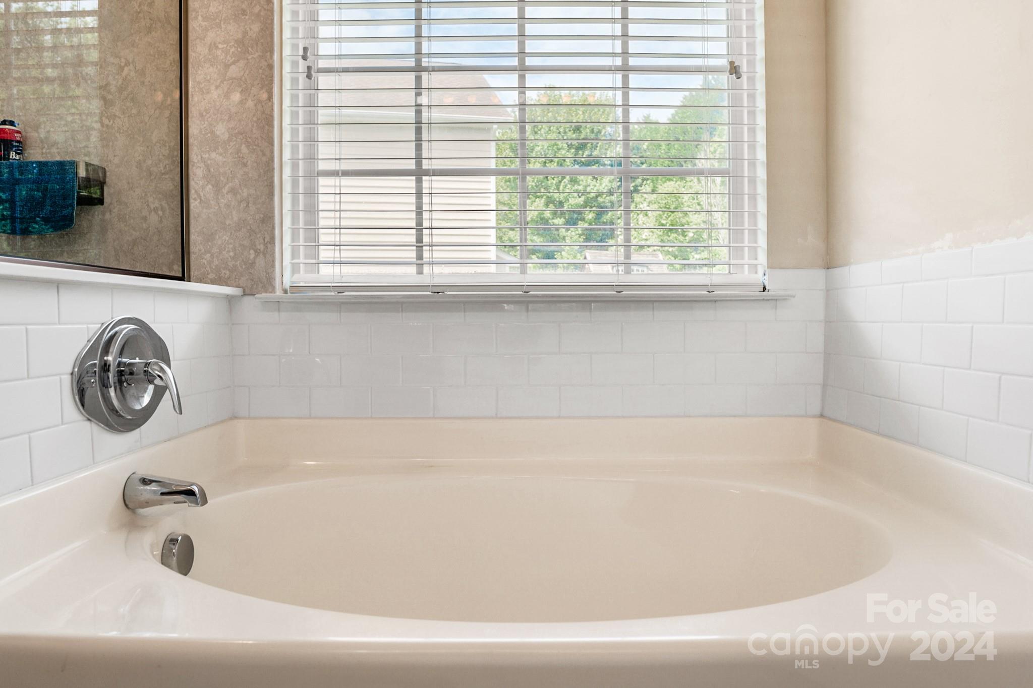 508 Marblewood Court Fort Mill, SC 29708 - Photo 13 of 21 a bathroom with a bathtub