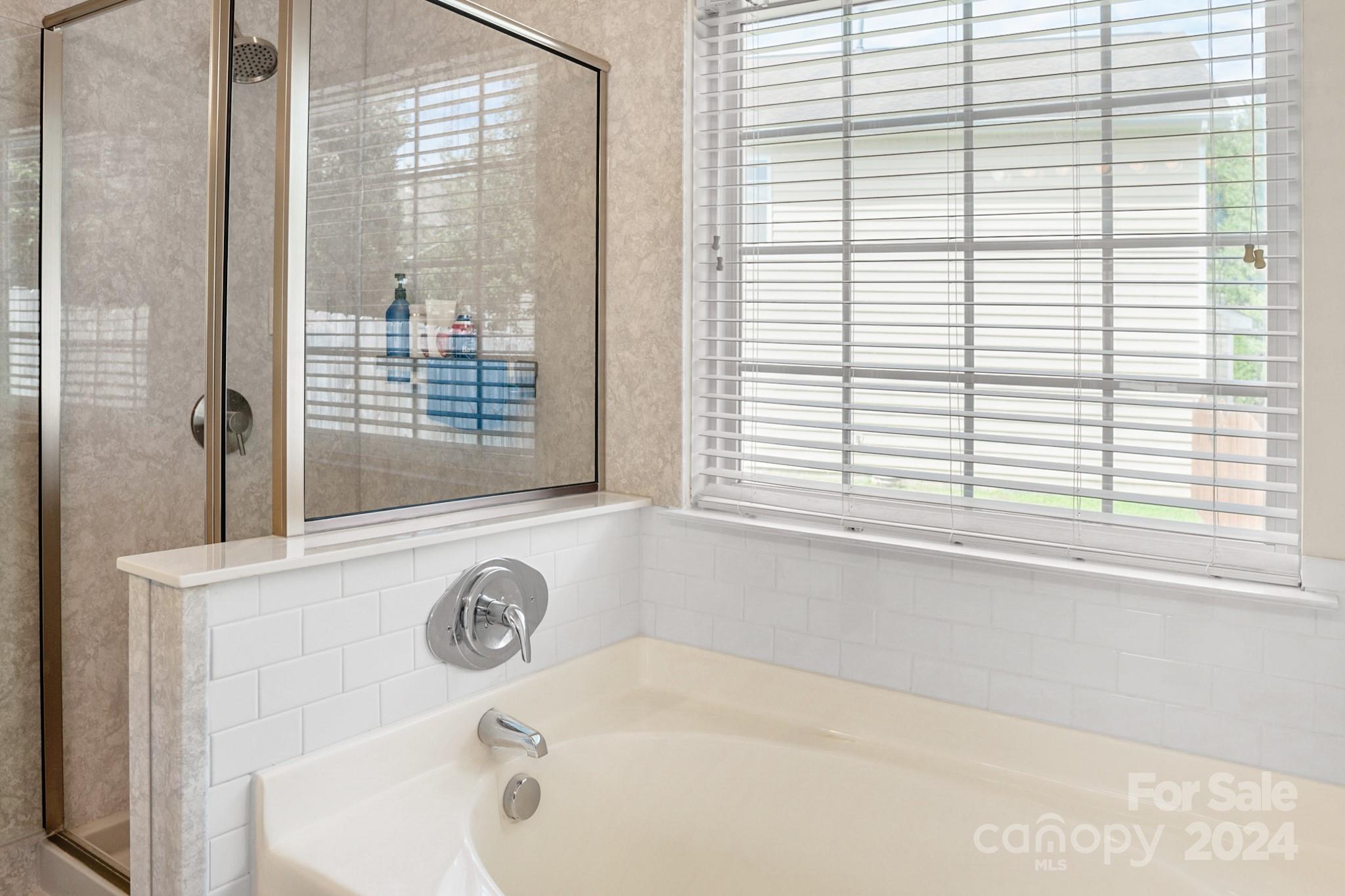 508 Marblewood Court Fort Mill, SC 29708 - Photo 14 of 21 a bathroom with a bathtub and a shower