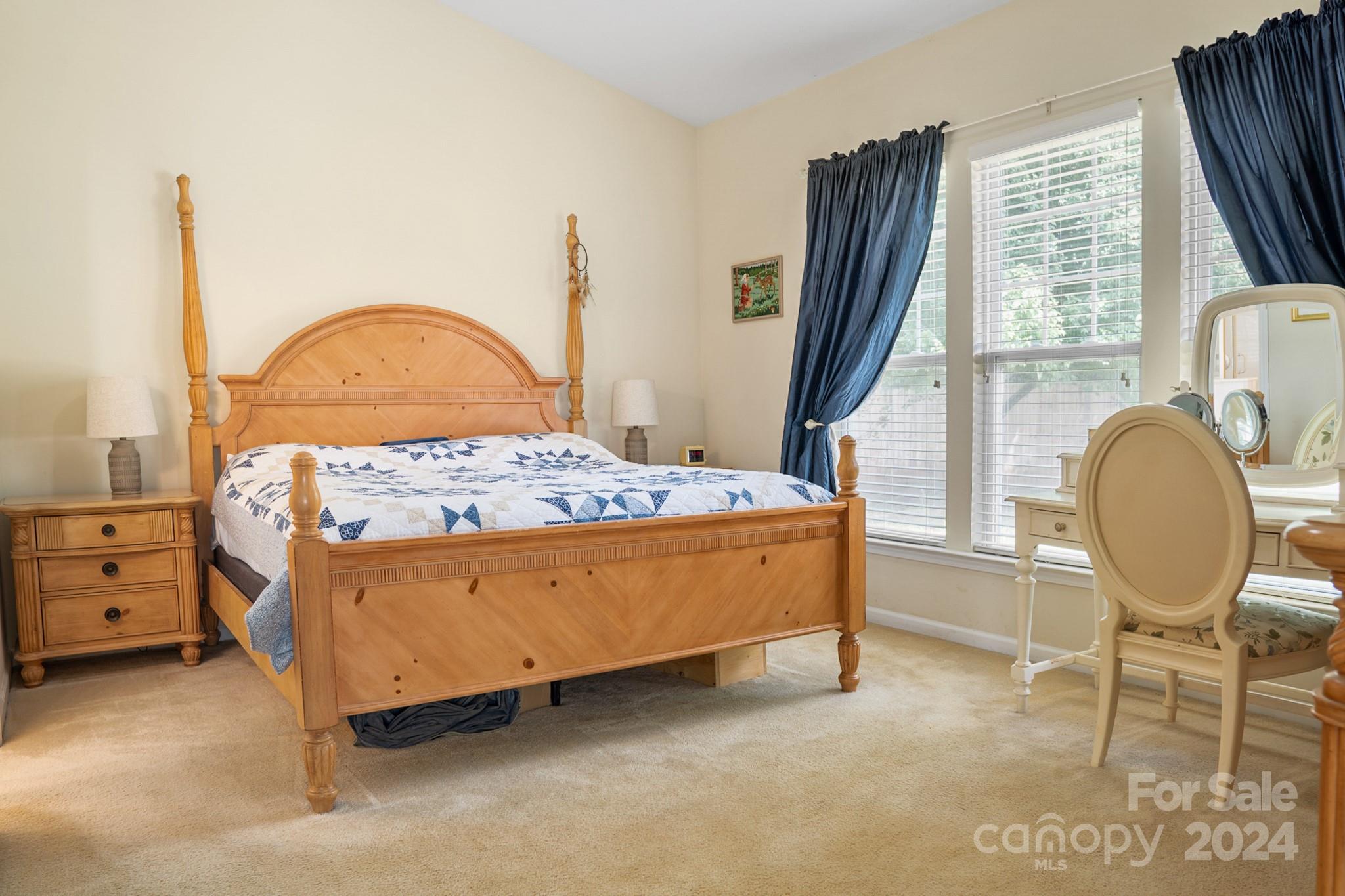 508 Marblewood Court Fort Mill, SC 29708 - Photo 10 of 21 a bed sitting in a bedroom next to a window