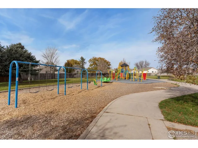 a view of a park with swings
