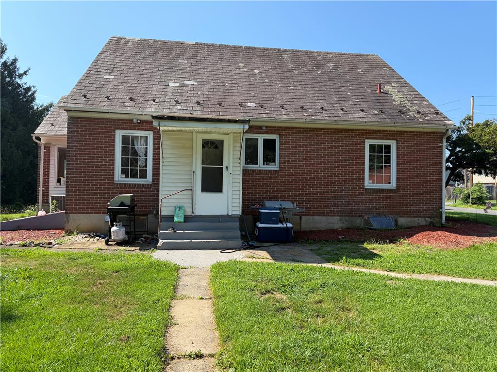 4023 Oakland Road Bethlehem, PA 18020 - Photo 3 of 14 A classic brick exterior with a welcoming porch entry awaits, offering a practical living space.