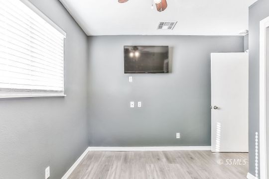 515 South Downs Street Ridgecrest, CA 93555 - Photo 21 of 31 a view of a livingroom with wooden floor and a window