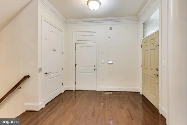 a view of entryway with wooden floor