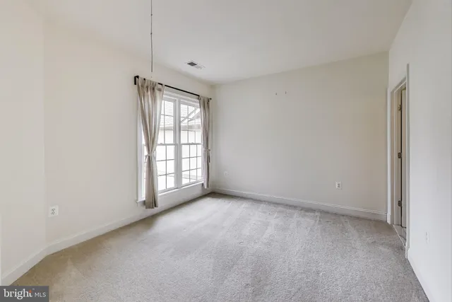 a view of a room with a wardrobe space