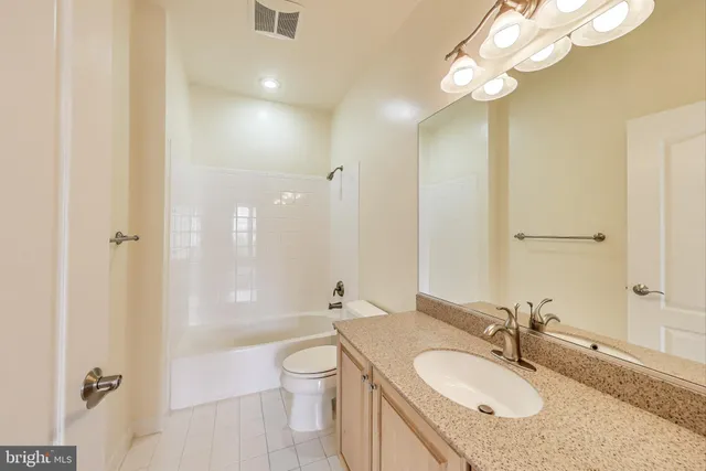 a bathroom with a toilet a sink and a bathtub