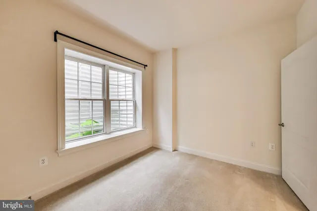 a front view of a house with a yard table and chairs