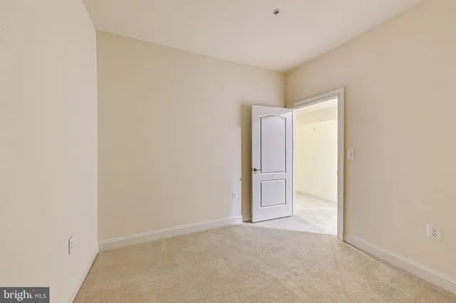 a view of a street with big building and large trees