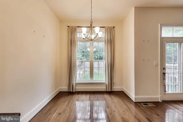 a view of a kitchen with a sink a refrigerator and a fireplace