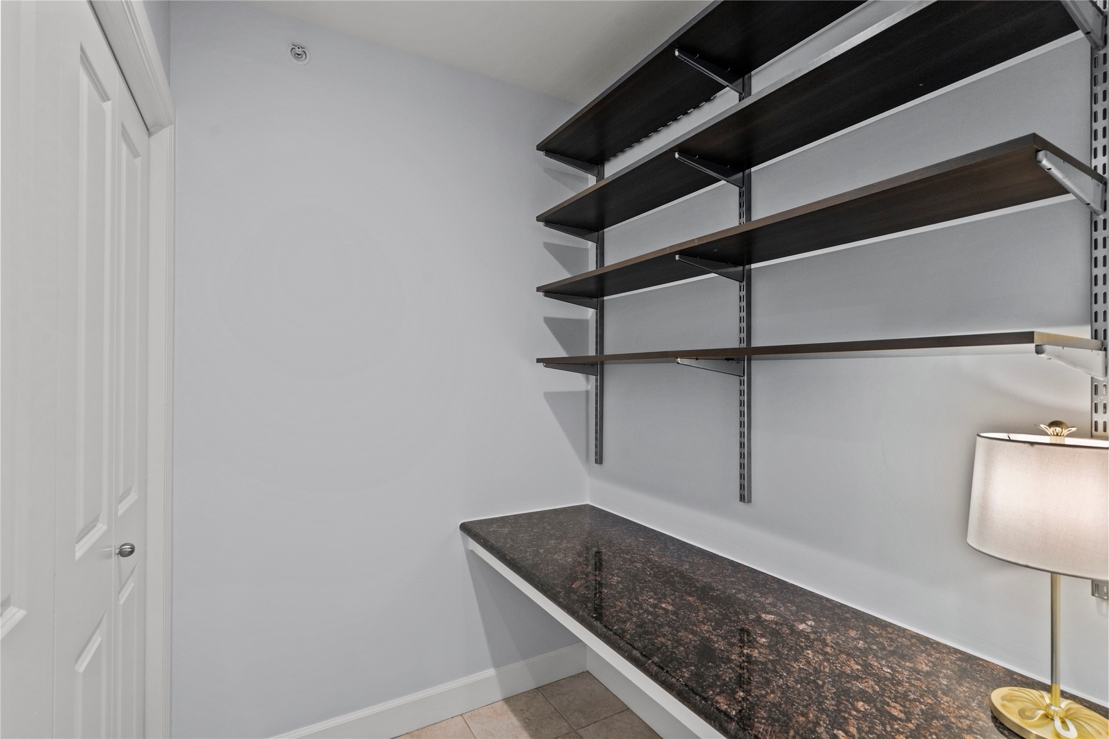 1900 Genesee Street, Unit 203 Houston, TX 77006 - Photo 21 of 30 This photo shows the office space with shelves.