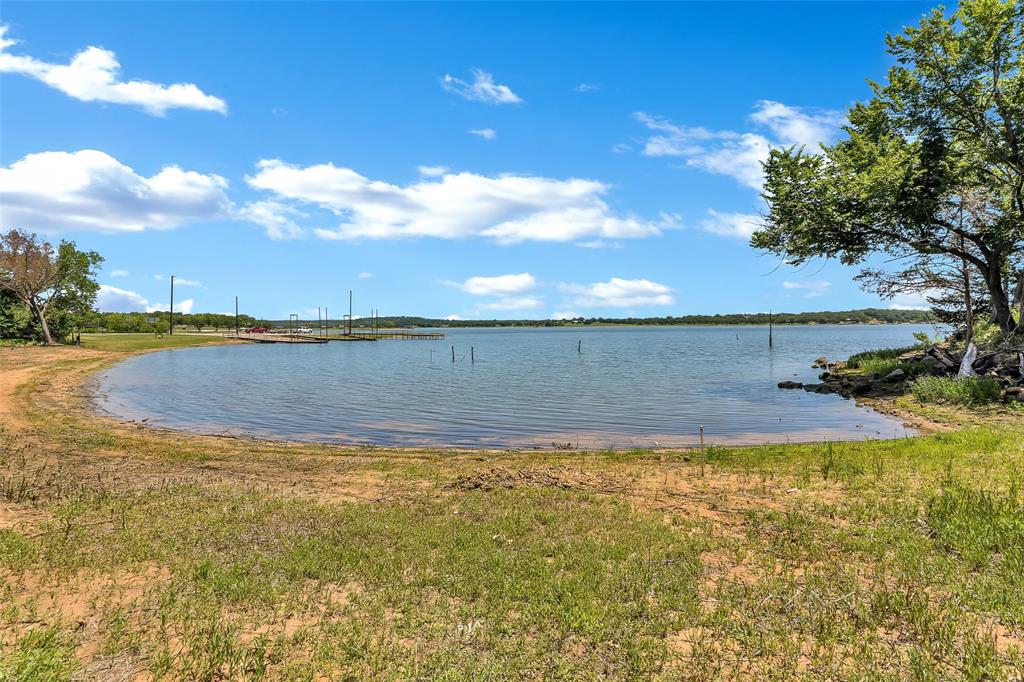 566 Selma Park Road Bowie, TX 76230 - Photo 34 of 40 Expansive waterfront property featuring a natural shoreline, mature trees, and direct lake access
