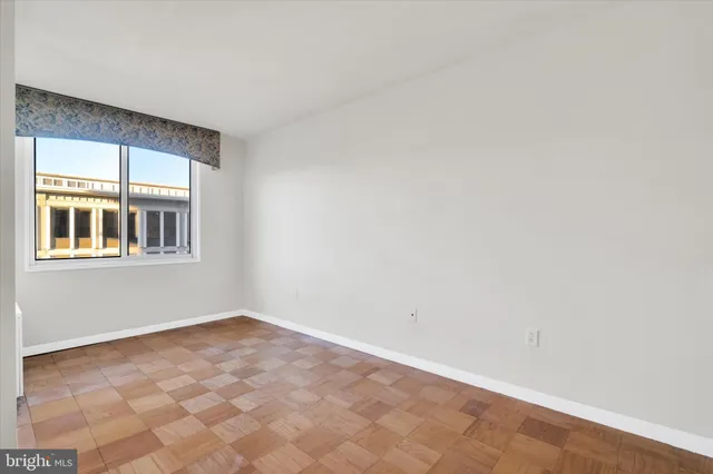 a view of an empty room with a window