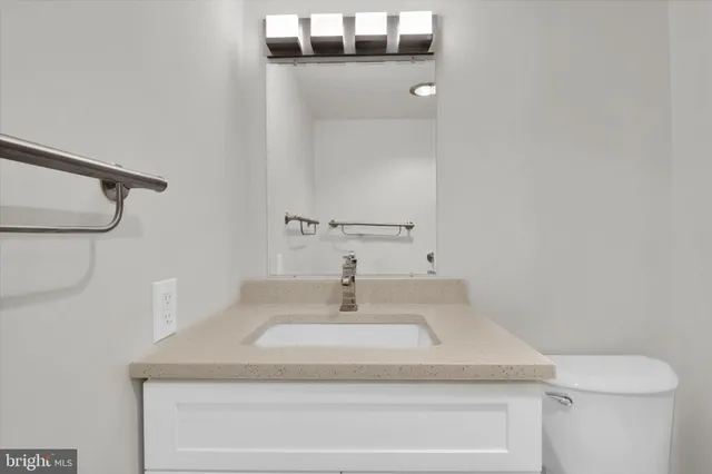 a bathroom with a sink and mirror