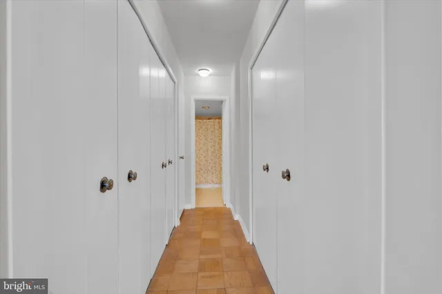 a view of a hallway with a door