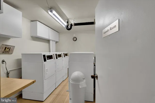 a hallway with washer and dryer