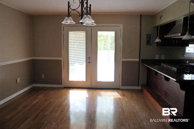 12836 Anna's Way Stapleton, AL 36578 - Photo 9 of 43 Beautiful flooring, Chair railing, French doors, Open to kitchen, Bar top sitting