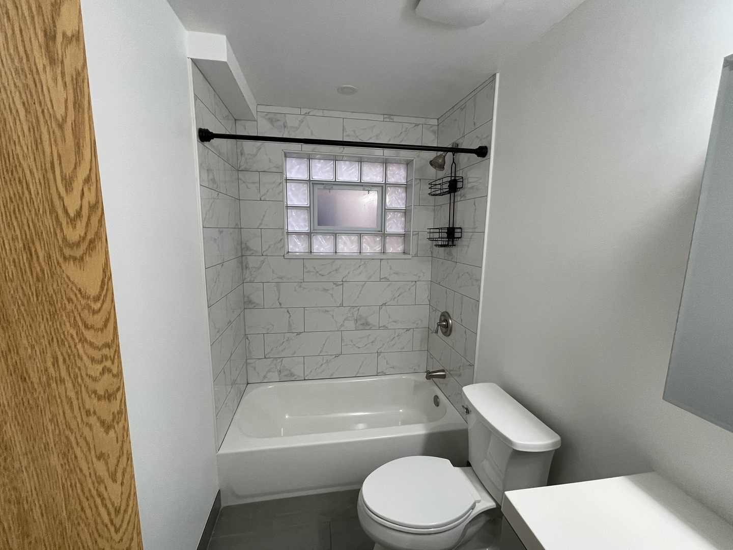 8511 West Gregory Street, Unit 2N Chicago, IL 60656 - Photo 7 of 15 a bathroom with a toilet and a bathtub