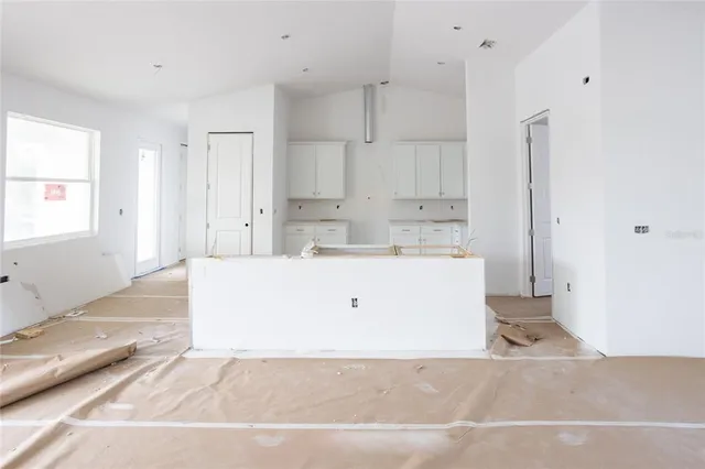 a room with white cabinets