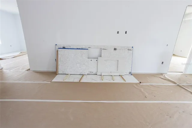 an empty room with sliding glass door