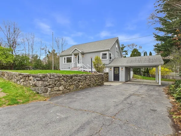 front view of a house with a garden