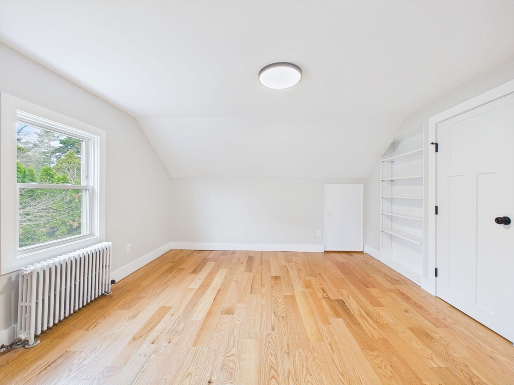 9 Burt Street Acushnet, MA 02743 - Photo 20 of 29 a view of empty room with wooden floor and fan