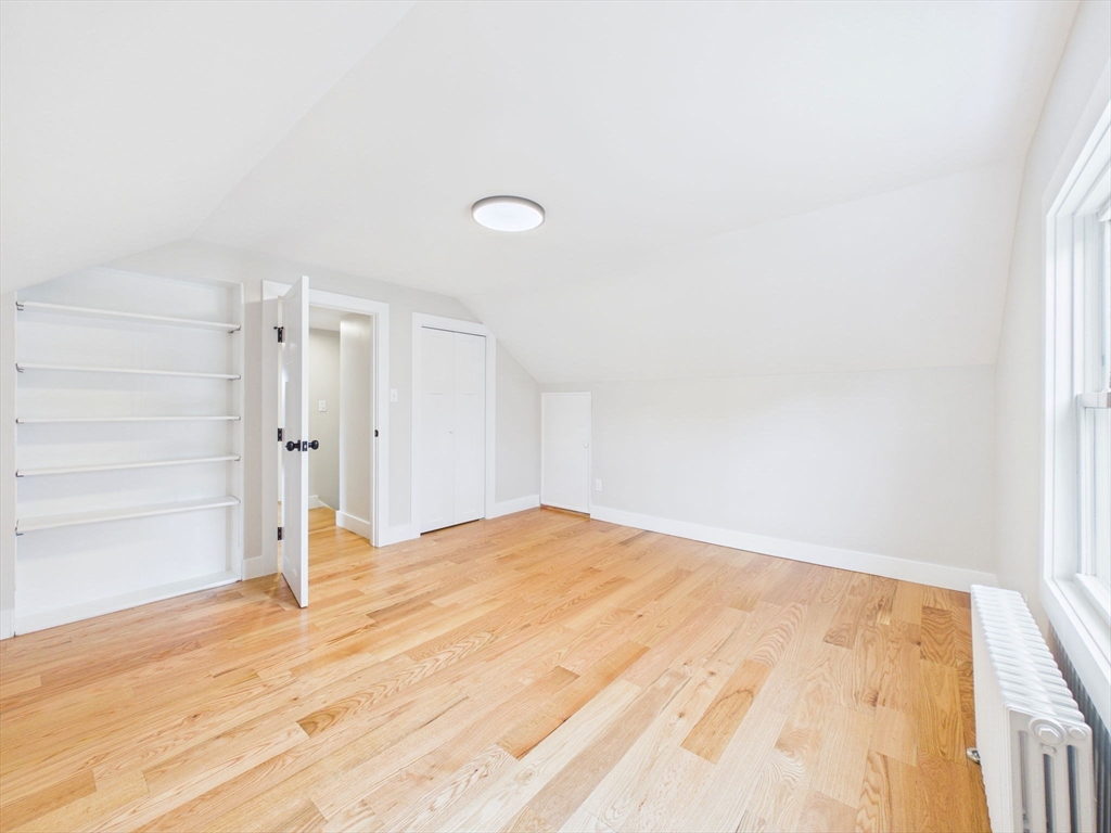 9 Burt Street Acushnet, MA 02743 - Photo 21 of 29 a view of empty room with wooden floor and fan