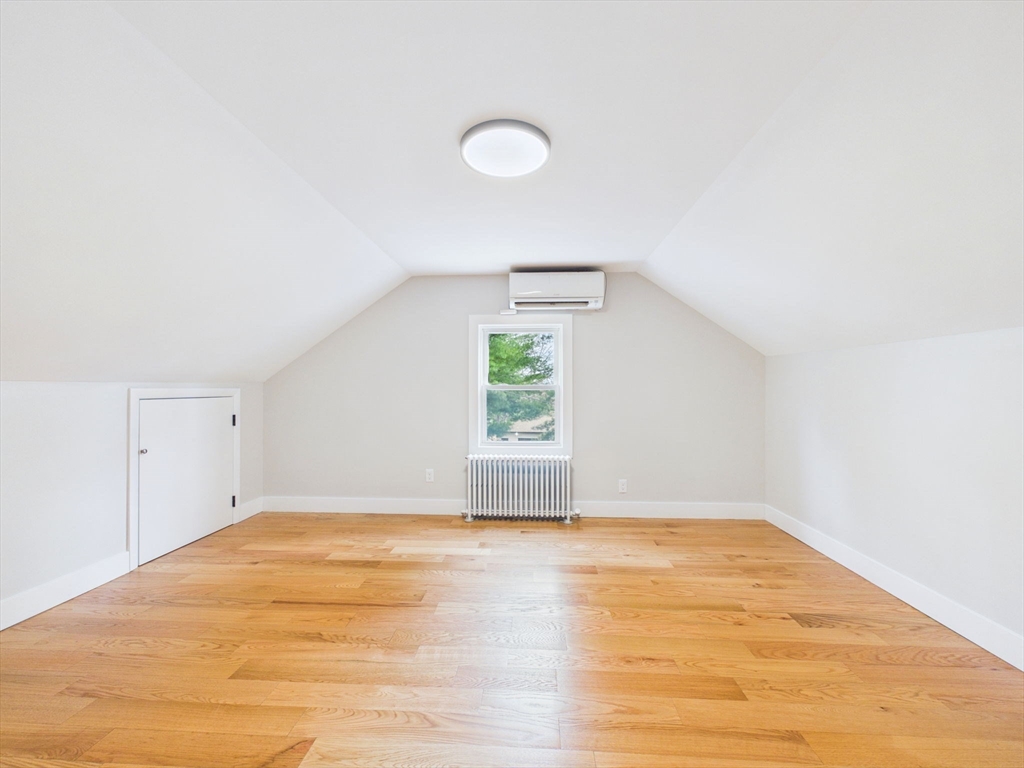 9 Burt Street Acushnet, MA 02743 - Photo 22 of 29 a view of empty room with wooden floor and fan
