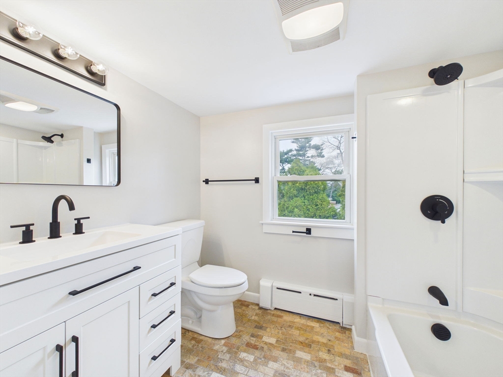 9 Burt Street Acushnet, MA 02743 - Photo 24 of 29 a bathroom with a toilet sink a mirror a window and shower