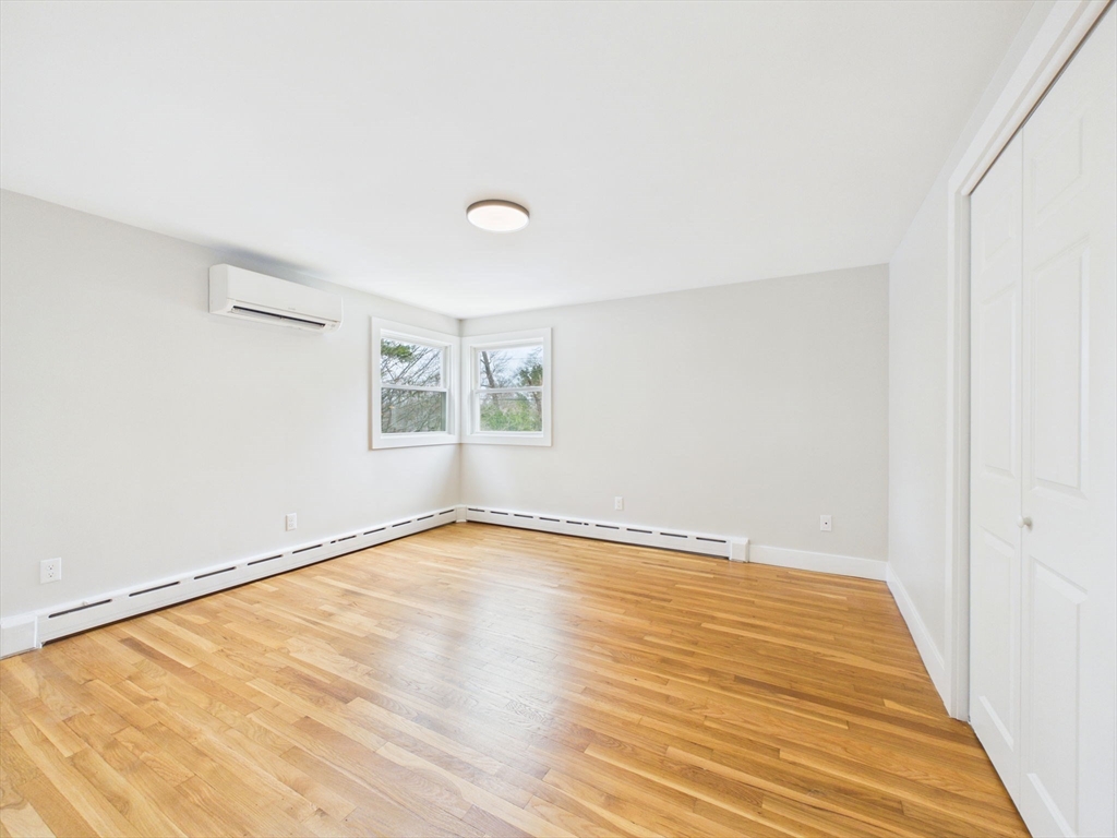9 Burt Street Acushnet, MA 02743 - Photo 27 of 29 a view of an empty room with wooden floor and a window