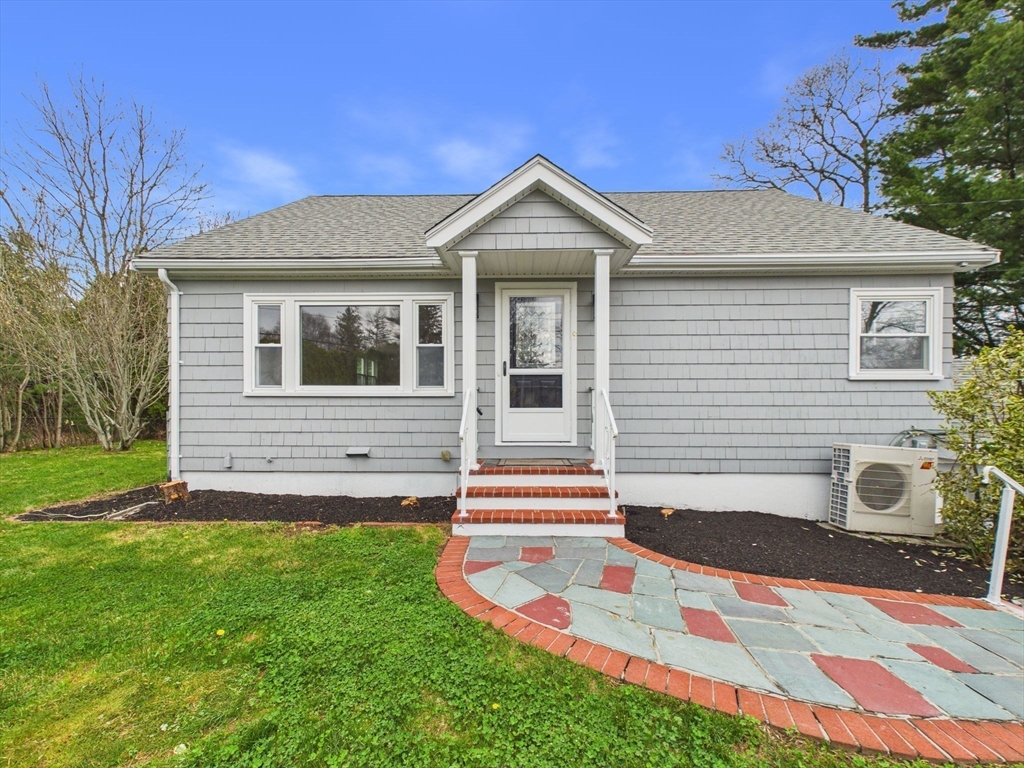 9 Burt Street Acushnet, MA 02743 - Photo 3 of 29 a front view of a house with a yard