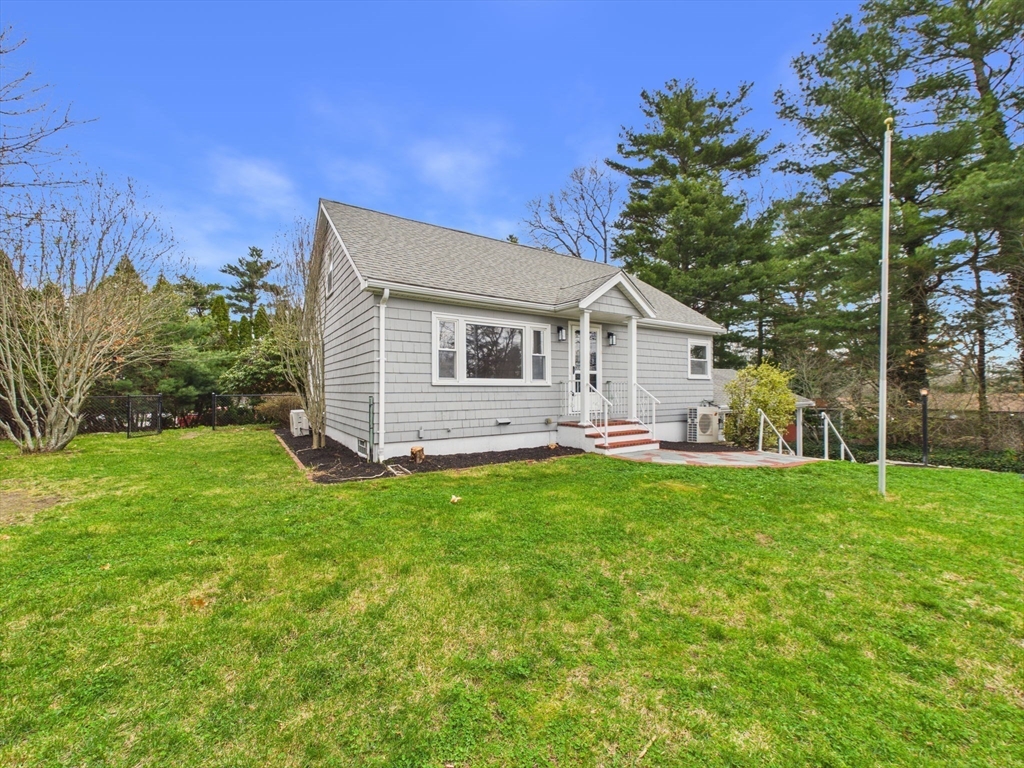 9 Burt Street Acushnet, MA 02743 - Photo 4 of 29 a front view of a house with yard and green space