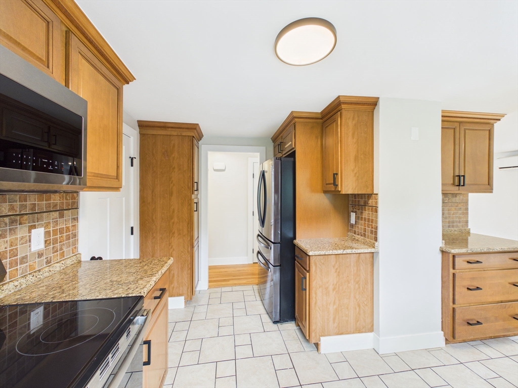 9 Burt Street Acushnet, MA 02743 - Photo 8 of 29 a kitchen with stainless steel appliances granite countertop a refrigerator and a stove