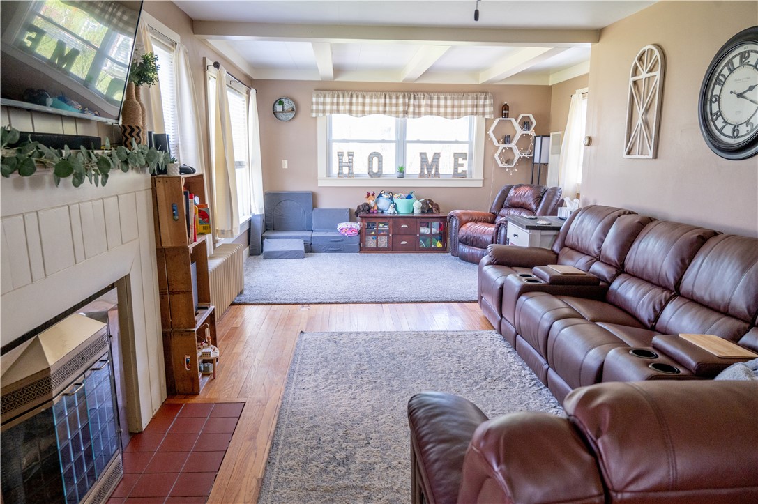3365 Trapping Brook Road Wellsville, NY 14895 - Photo 5 of 47 This Living room has a gas fireplace and tons of natural light.