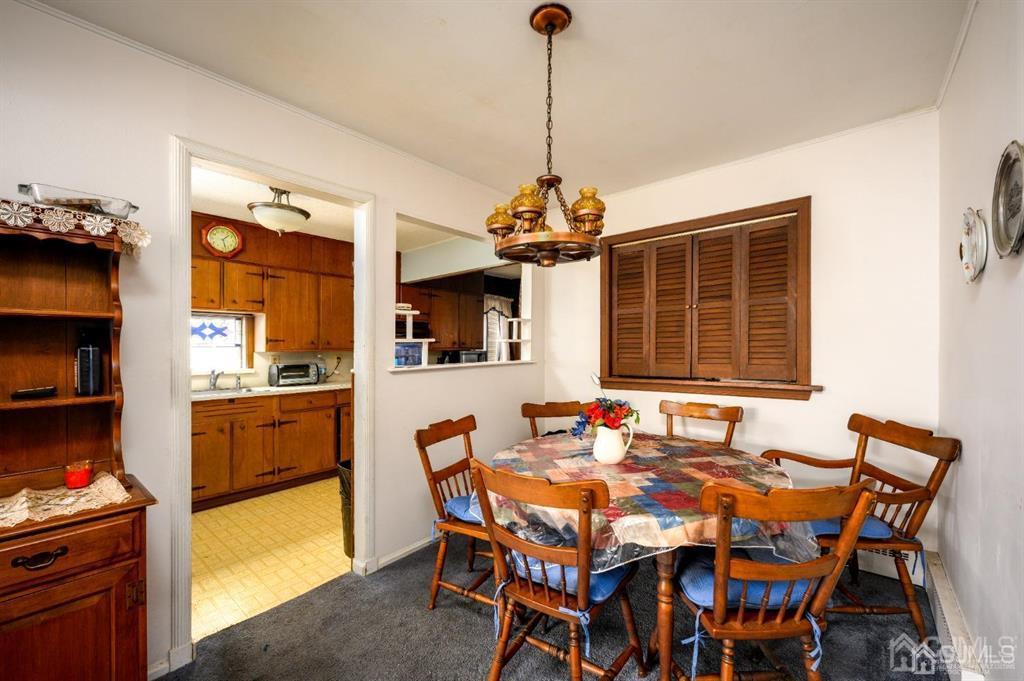 183 Midfield Road Colonia, NJ 07067 - Photo 23 of 40 a dinning table and chairs in a room