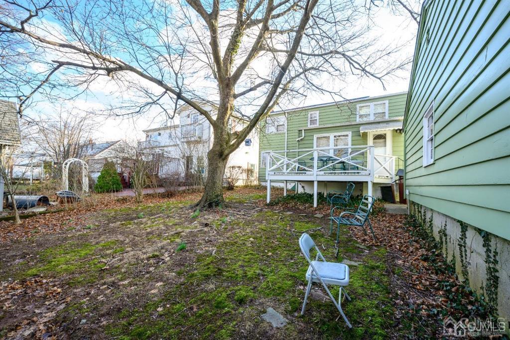 183 Midfield Road Colonia, NJ 07067 - Photo 6 of 40 a view of a house with backyard and a tree