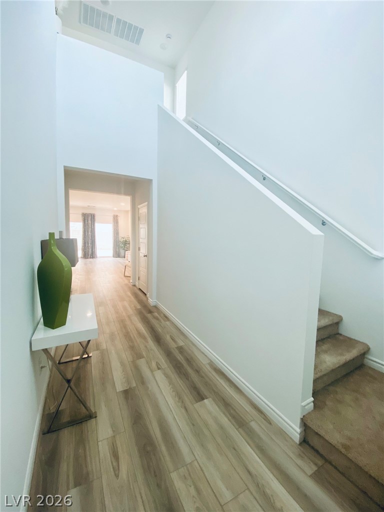 4457 Sawyer Ridge Street Las Vegas, NV 89147 - Photo 9 of 32 This bright hallway showcases high ceilings and durable flooring.