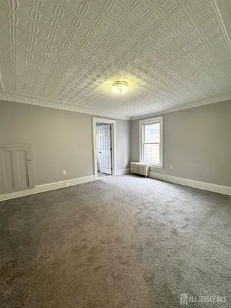 a view of empty room with windows
