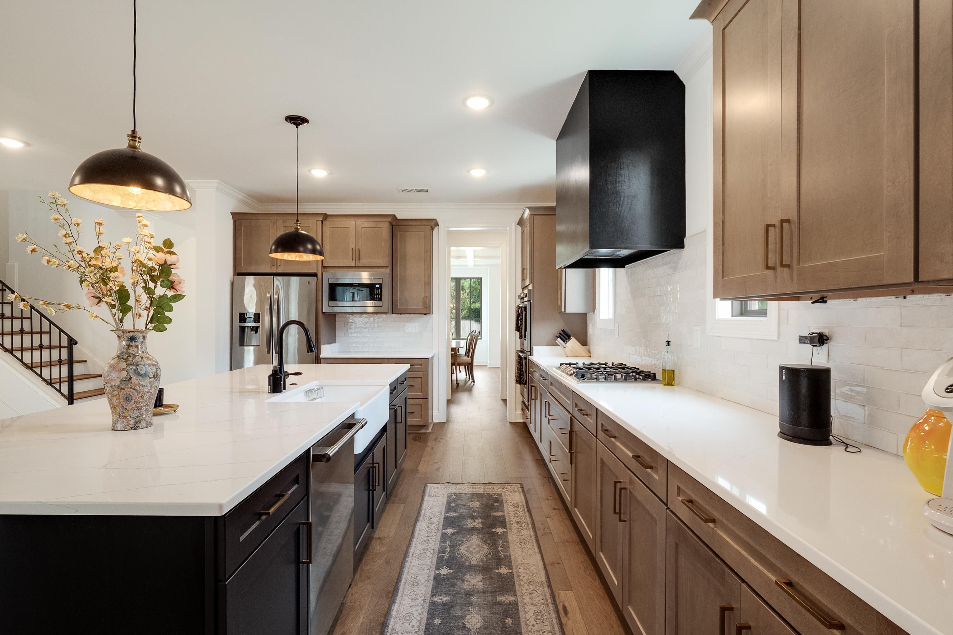 964 Collierville Arlington Road Collierville, TN 38017 - Photo 10 of 40 a kitchen with stainless steel appliances granite countertop a sink a stove and a refrigerator