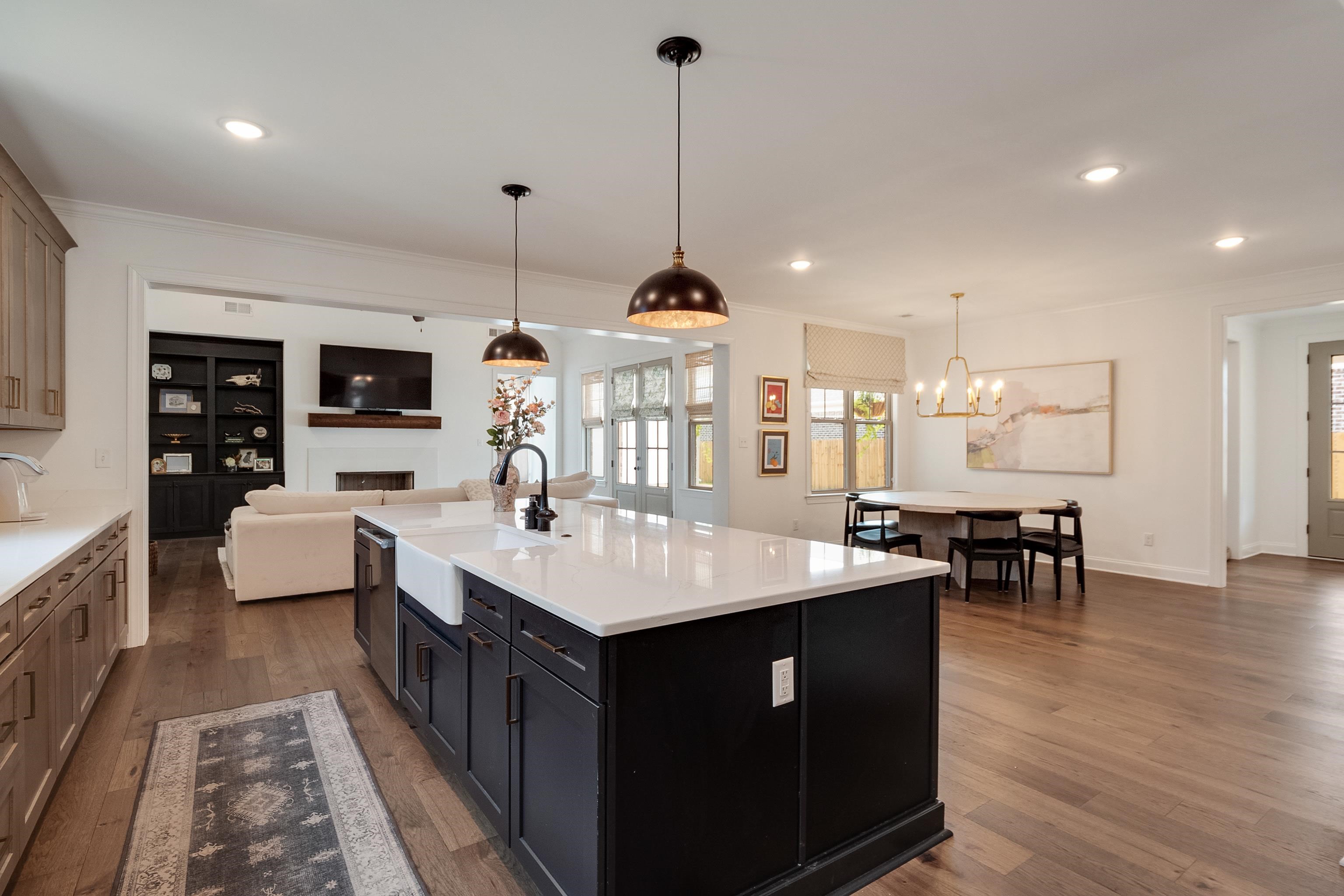 964 Collierville Arlington Road Collierville, TN 38017 - Photo 40 of 40 a large kitchen with kitchen island a sink a counter space and stainless steel appliances
