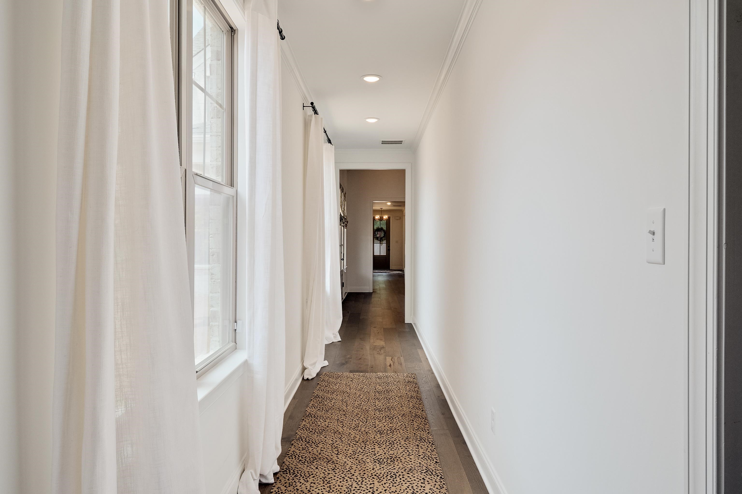 964 Collierville Arlington Road Collierville, TN 38017 - Photo 15 of 40 a view of a hallway with wooden floor and staircase