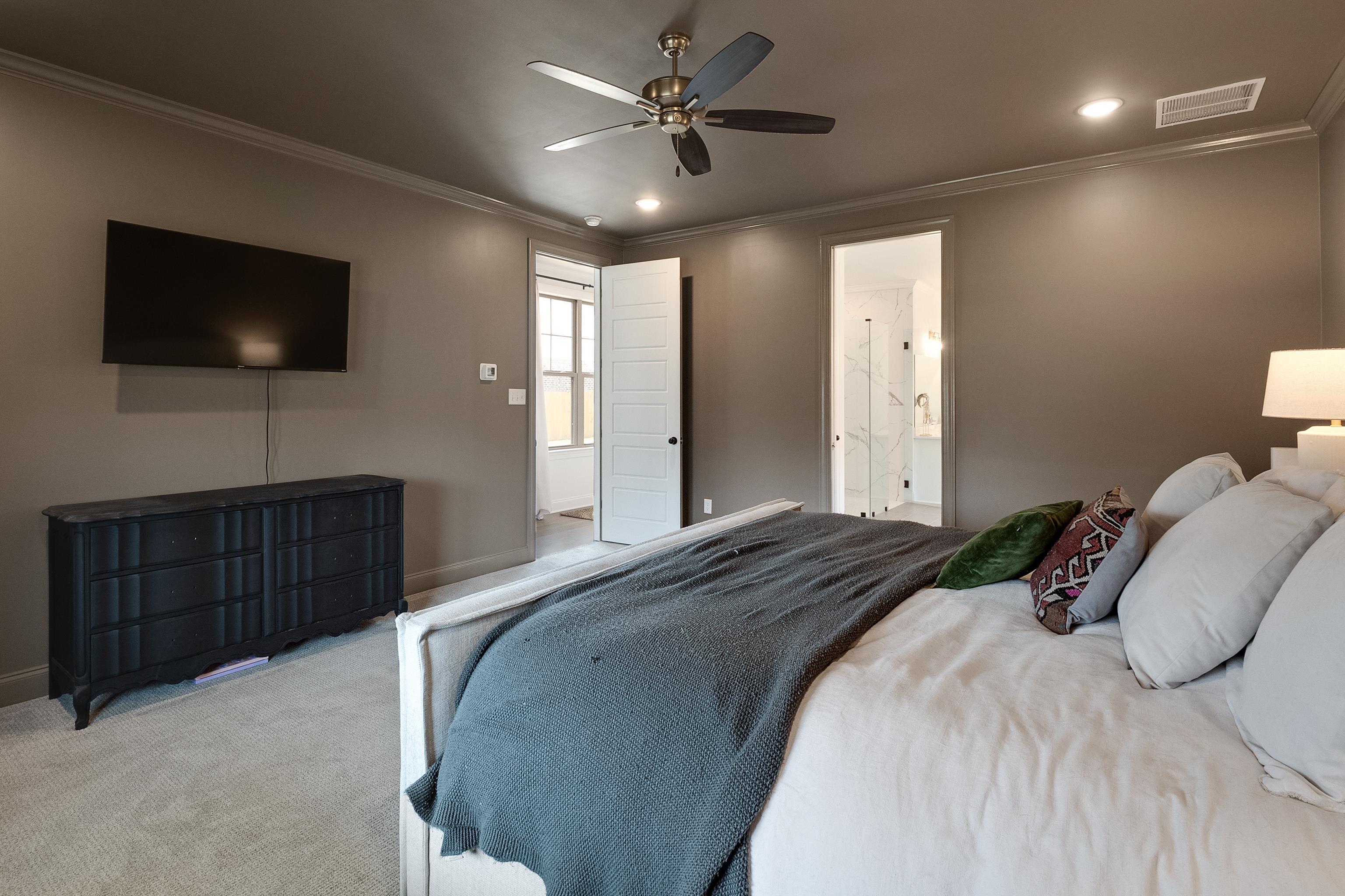 964 Collierville Arlington Road Collierville, TN 38017 - Photo 17 of 40 a bedroom with a bed and a flat screen tv