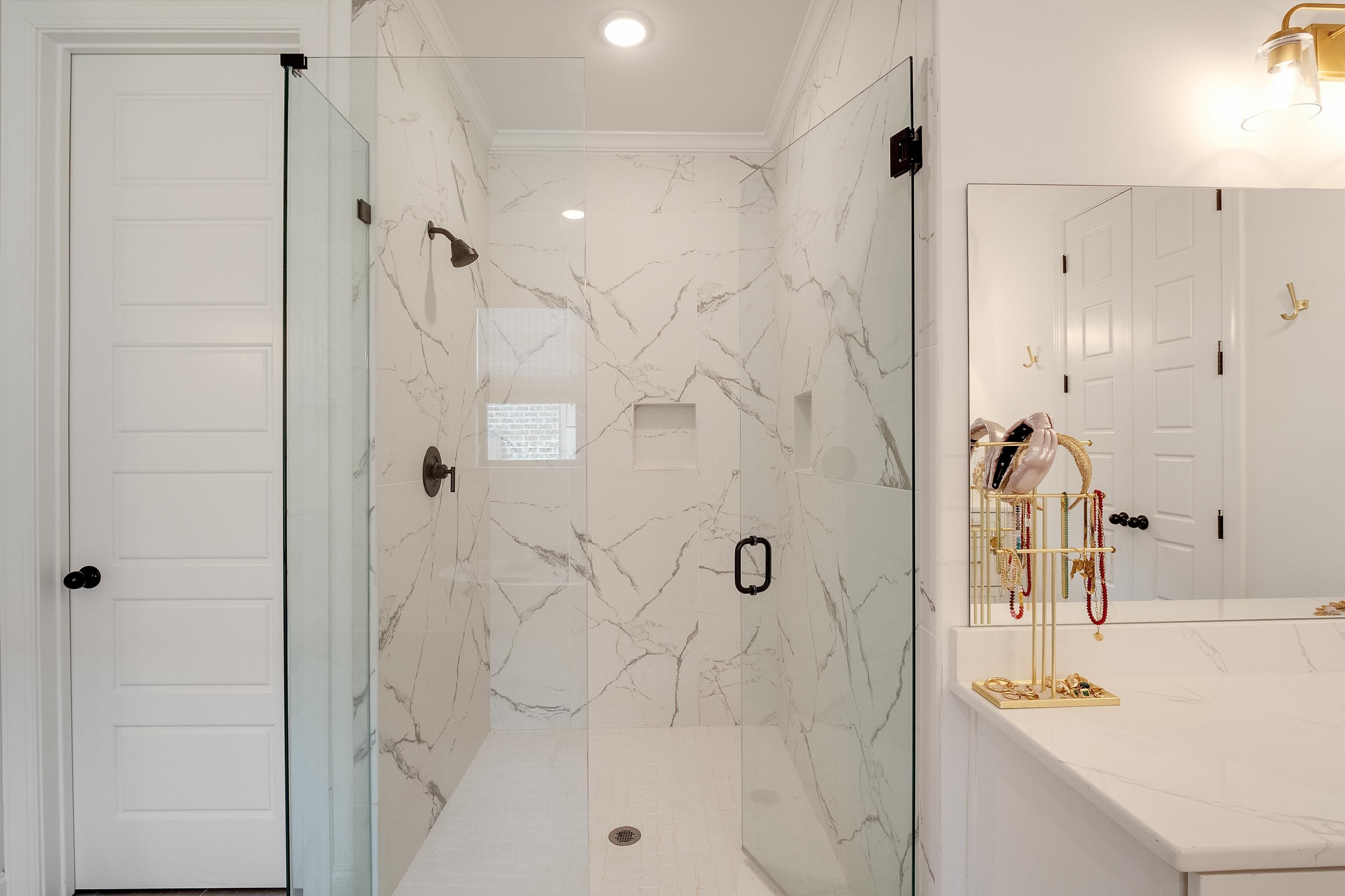 964 Collierville Arlington Road Collierville, TN 38017 - Photo 21 of 40 a bathroom with a sink vanity granite shower and a mirror