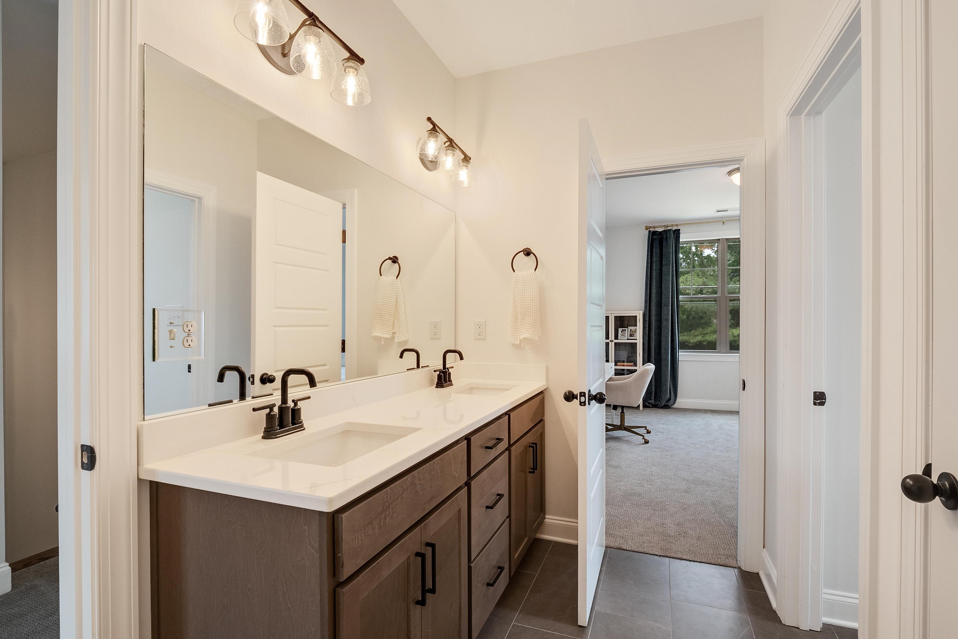 964 Collierville Arlington Road Collierville, TN 38017 - Photo 30 of 40 a bathroom with a sink double vanity and a mirror