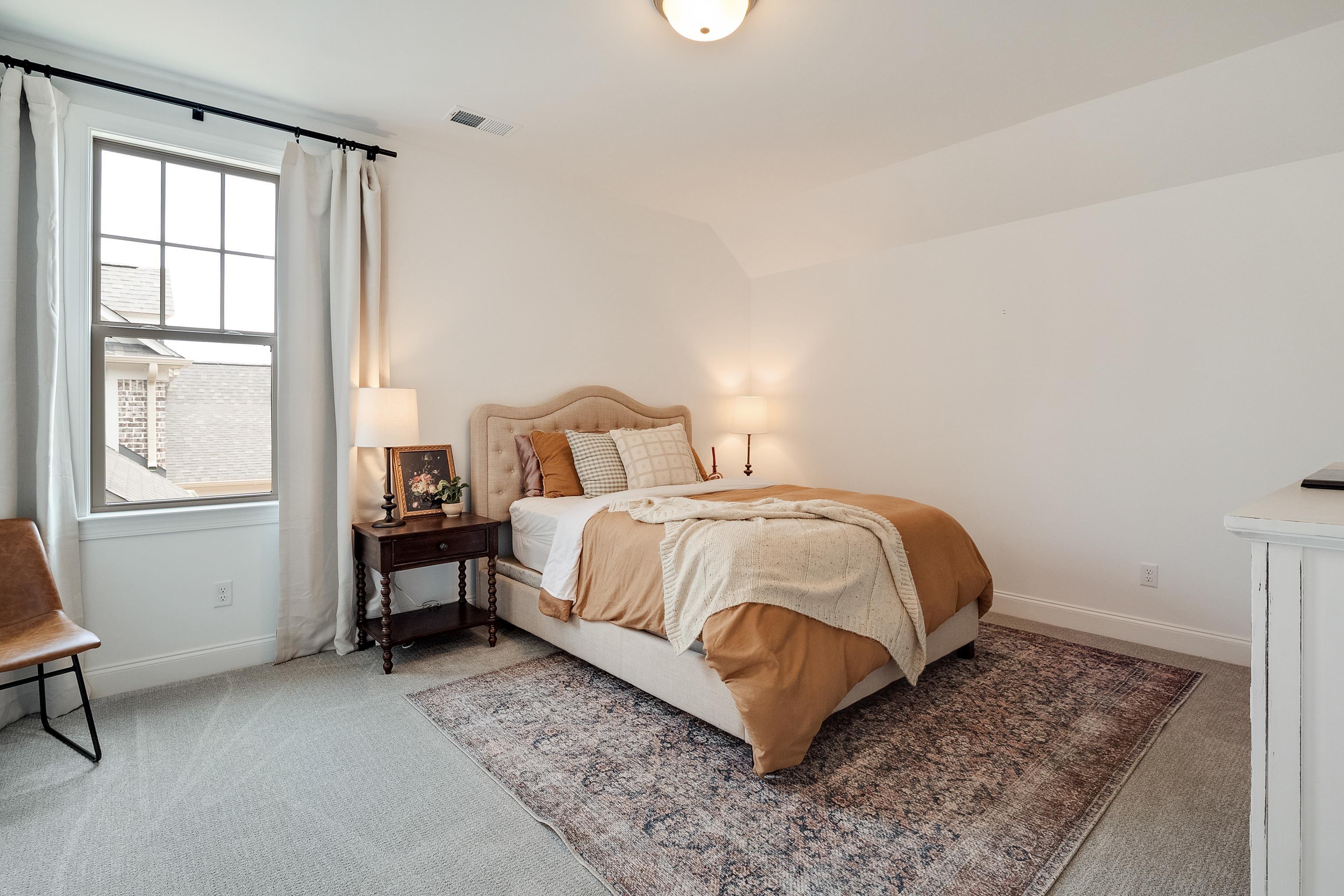 964 Collierville Arlington Road Collierville, TN 38017 - Photo 31 of 40 a bedroom with a bed and wooden floor