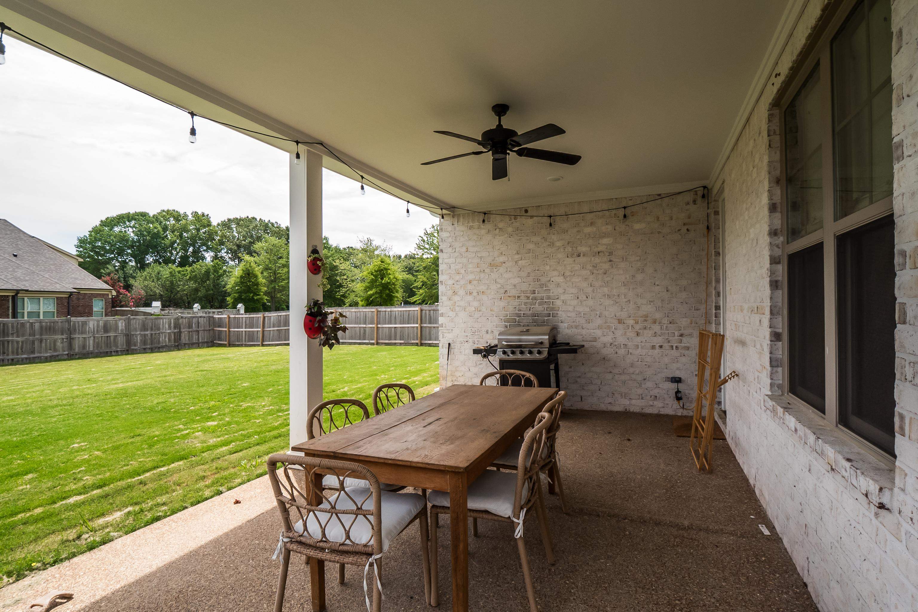 964 Collierville Arlington Road Collierville, TN 38017 - Photo 35 of 40 a view of a porch with furniture and a yard