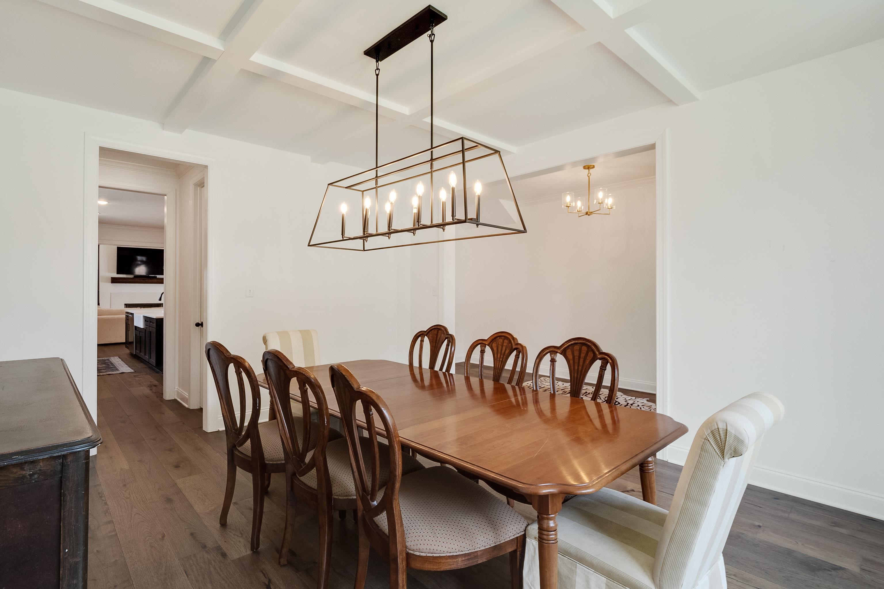 964 Collierville Arlington Road Collierville, TN 38017 - Photo 7 of 40 a view of a dining room with furniture wooden floor and chandelier