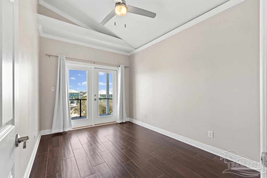 321 Gulfview Lane Perdido Key, FL 32507 - Photo 32 of 57 an empty room with wooden floor and windows