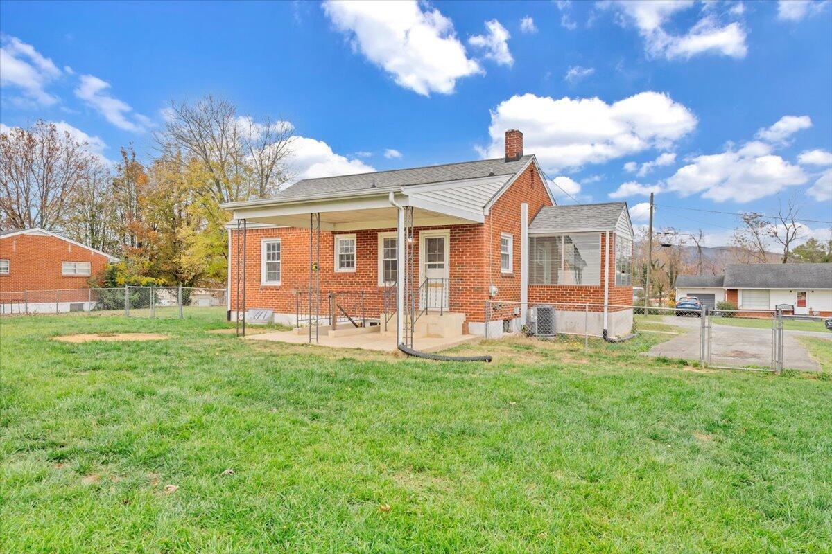 215 Post Road Roanoke, VA 24019 - Photo 28 of 42 a front view of house with yard and outdoor seating