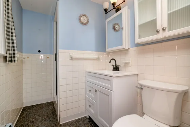 a bathroom with a sink toilet and vanity